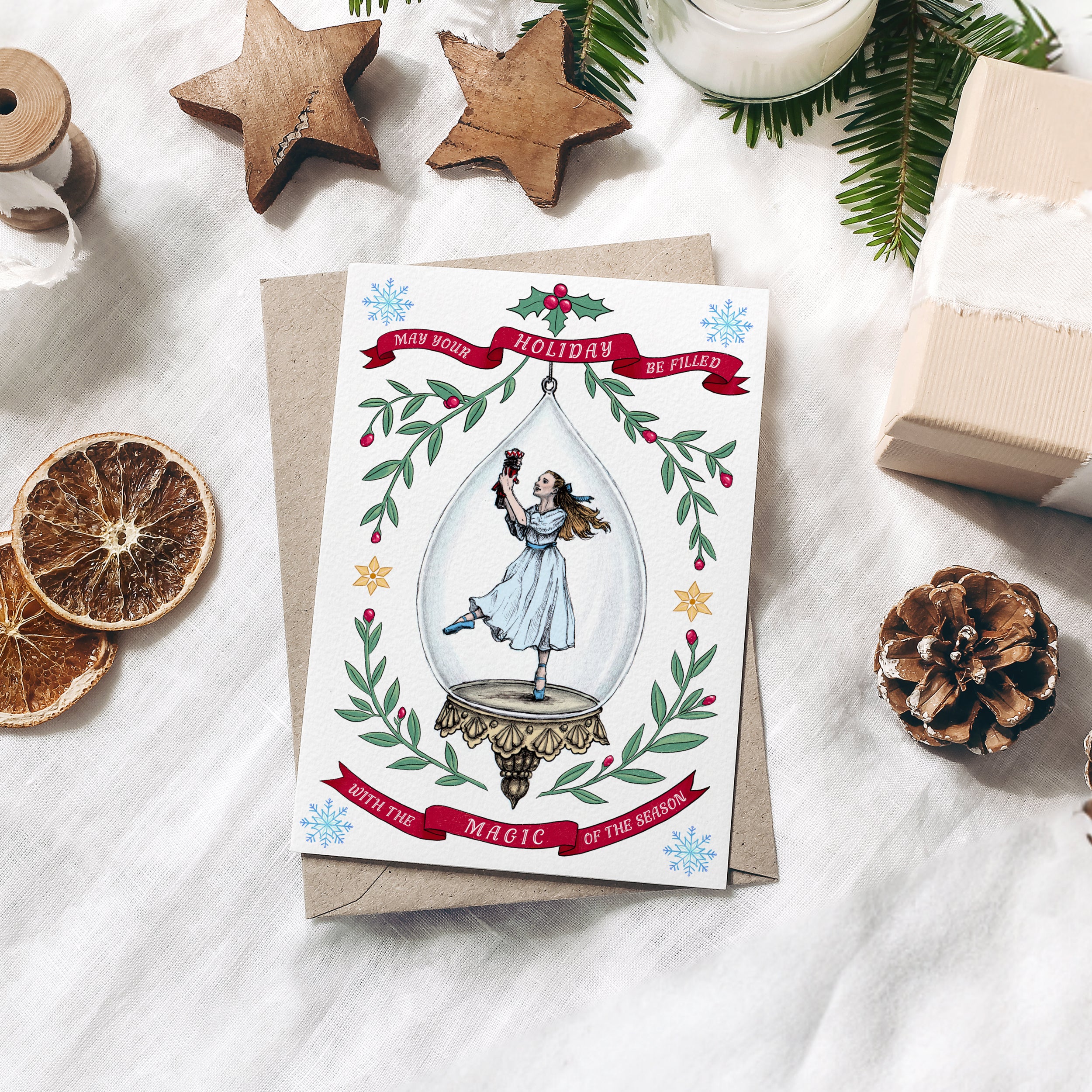Nutcracker Christmas Card Clara Ballerina Dancing with her Nutcracker inside a vintage Christmas Ornament surrounded by winter greenery, holy and ribbon - handmade greeting card by Kimro Studio