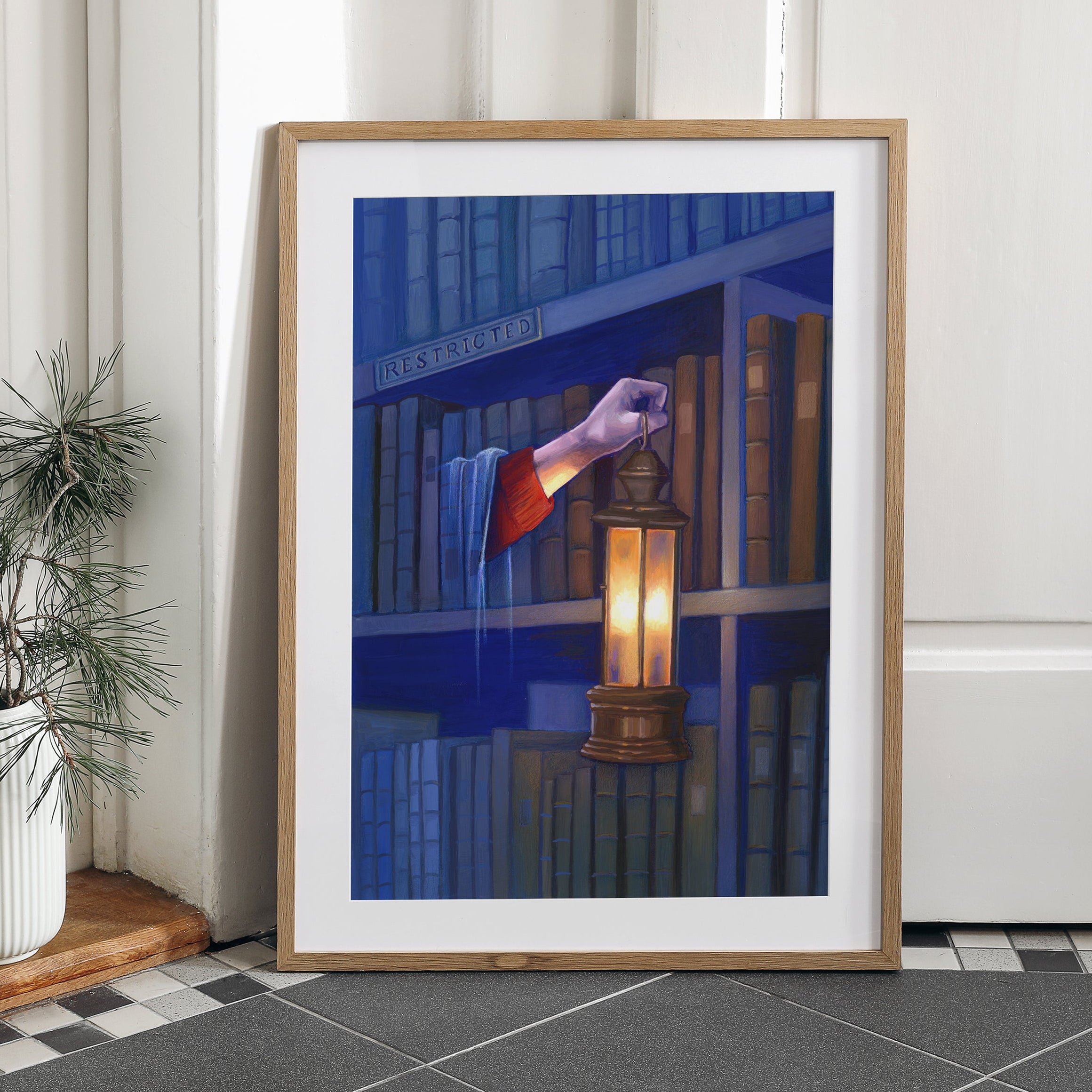Art print of Harry Potter under the invisibility cloak holding his lantern out to find a book about Nicholas Flammel in the restricted section of the Hogwarts library at night